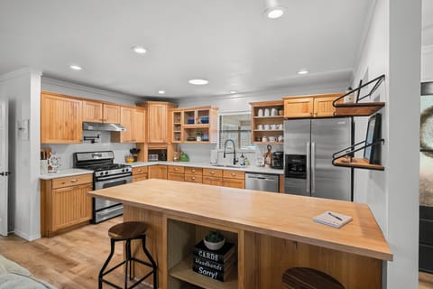 Seating for 2 at the bar! Plus games in the island shelves for you to enjoy!