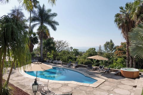 Pool & Landscape | Aerial view highlighting the sun-heated pool and hillside retreat