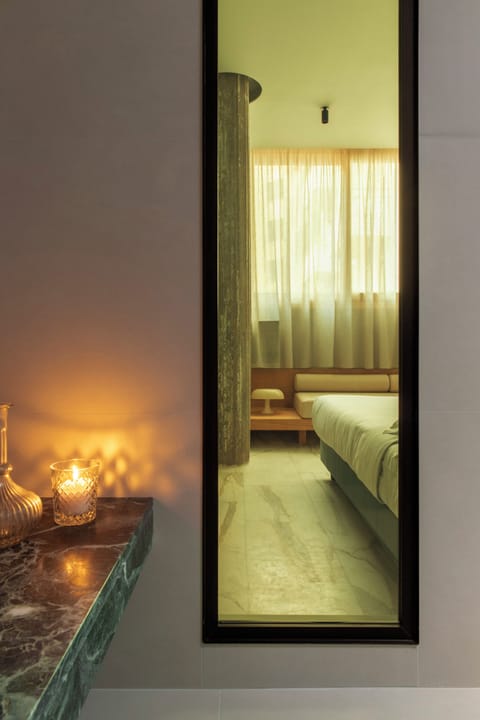 Deluxe Triple Room | Minibar, in-room safe, desk, laptop workspace