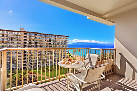 Oceanview balcony dining with sweeping blue views, gentle breezes, and a front-row seat to paradise.  This scene captures the essence of five-star relaxation—sun, sea, and sophistication in perfect harmony.