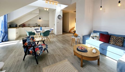 Comfort Apartment, Balcony | Living area | 50-inch LCD TV with cable channels