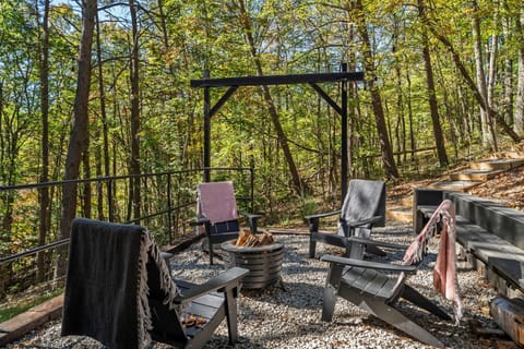 Perfect for families and friend groups of up to six who want the full cabin experience — original log construction, wraparound deck, electric fireplace, dogs welcome.