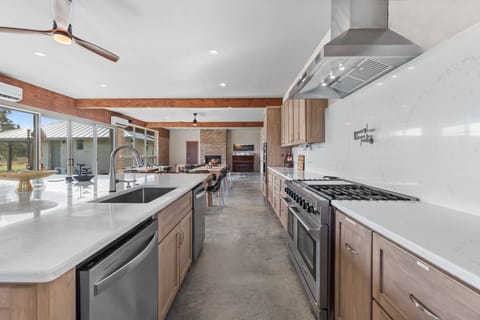 Professional kitchen w/48" gas range.