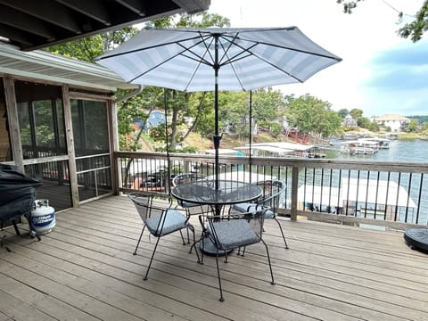 Open deck with additional dining, Blackstone grill, gas grill, and charcoal grill