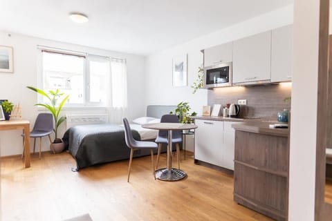 Deluxe Quadruple Room, Balcony | Living area | 60-cm Smart TV with cable channels, heated floors, printers