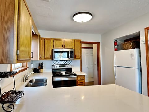 Fully Equipped Kitchen with Breakfast Bar Seating for Two