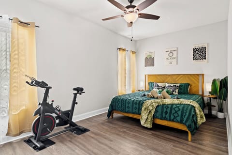Enjoy a luxurious King bed, a TV, and a dedicated fitness area.