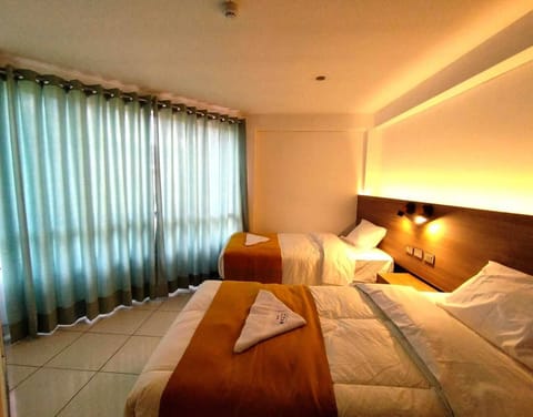 Comfort Quadruple Room, City View | Premium bedding, down comforters, desk, laptop workspace