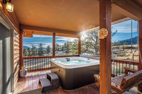 Enjoy the morning by soaking in a hot tub with stunning serene mountain views