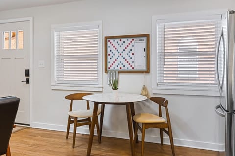 Fully equipped kitchen with all your cooking essentials, drip coffee maker + coffee. Dining table with seating for 2. This room opens up into the living room. Gorgeous mid century modern decor all throughout the condo.