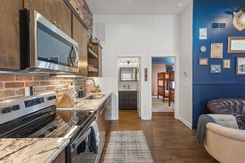 Fully equipped kitchen with all your cooking essentials, drip coffee maker + coffee. Dining table with seating for 2. This room opens up into the living room. Rustic and bold western decor throughout the entire condo!