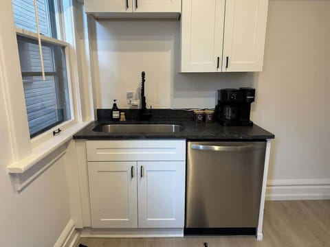 Elevate your culinary experience at Jungle House Airbnb with our sleek and modern kitchen, complete with stainless steel appliances and elegant finishes  Your gourmet retreat in Short North Columbus