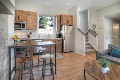 Main living space - The main floor with living room, kitchen, queen bedroom and bathroom.  Head upstairs to access the back patio and second and thrid bedrooms as well as the second bathroom and stackable washer and dryer.