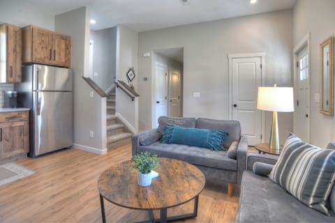 Open living room and kitchen - The main floor with living room, kitchen, queen bedroom and bathroom.  Head upstairs to access the back patio and second and thrid bedrooms as well as the second bathroom and stackable washer and dryer.