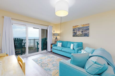 Open-concept living area with dining table and comfortable couches