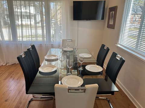 Nice dining table open concept with smart tv and sitting