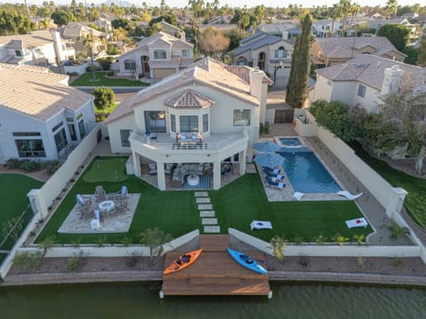 Wow! Our Val Vista Lakefront home with 5 BRs, 3 BAs, heated pool, spa. kayaks and putting green is spectacular!