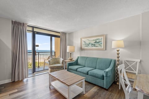 Soak in the sunshine and ocean breeze from this beautiful one-bedroom condo at Beach Cove Resort, Tower B. Floor-to-ceiling windows fill the space with natural light and stunning views of the pools and oceanfront; your perfect Myrtle Beach escape!