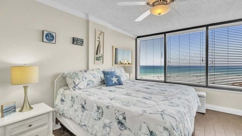 Wake up to stunning Gulf views and soothing waves in this cozy, beach-inspired room—perfect for relaxing after a sunny day.