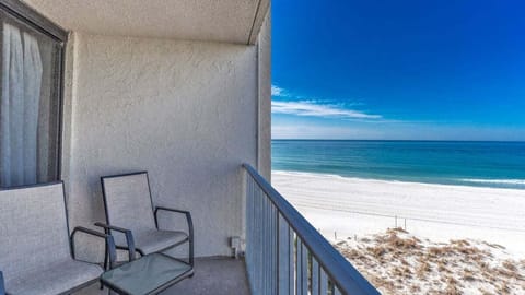 Step onto your private balcony and soak in panoramic Gulf views and the sound of waves. This cozy outdoor space is perfect for morning coffee or evening sunsets.