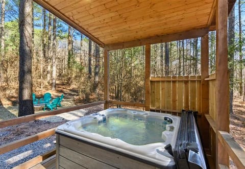 Relax in the private hot tub while soaking in the peaceful forest views—ideal for unwinding after a day of exploring.