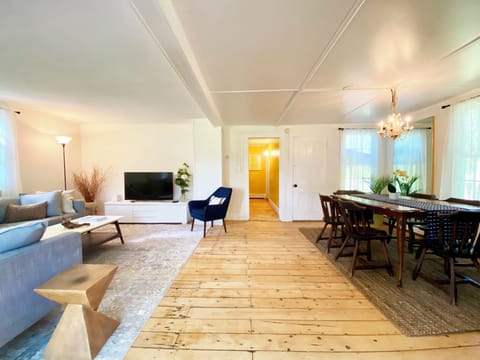 Airy, comfy living room with rustic hardwood floors
