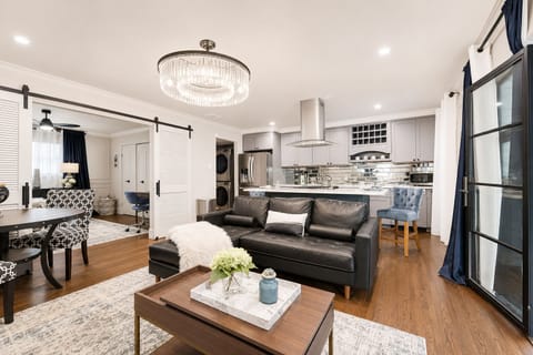 The living room features a large Smart TV, perfect for streaming your favorite shows and movies. With easy access to popular apps like Netflix, Hulu, and more, you'll have plenty of entertainment options during your stay.