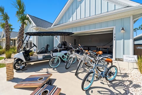 Your private garage comes stocked with bikes and a golf cart, making coastal adventures effortless from day one.