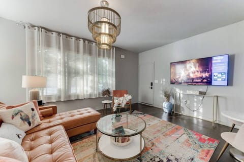 The living room features a large 65" Smart TV, perfect for streaming all your favorite shows and movies.