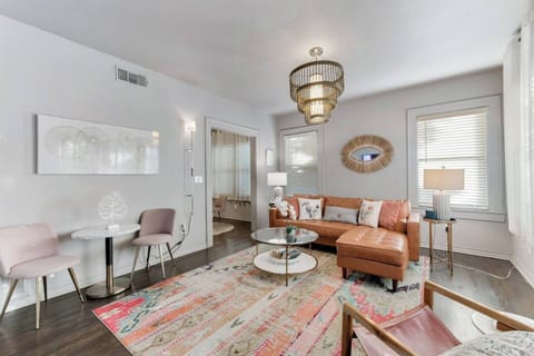 The living room also includes a dedicated workspace, making it easy to stay productive while enjoying the comfort of your space.