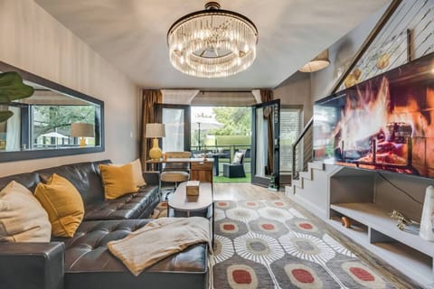 Spacious, open-concept living area that's bright and airy, offering plenty of room to relax on the leather sectional and unwind.