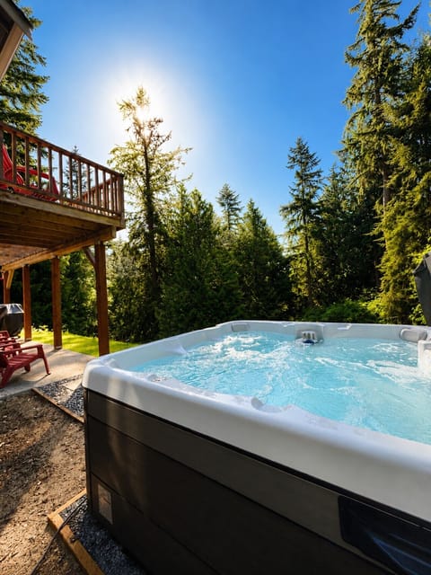 Private hot tub surrounded by trees for a relaxing forest retreat