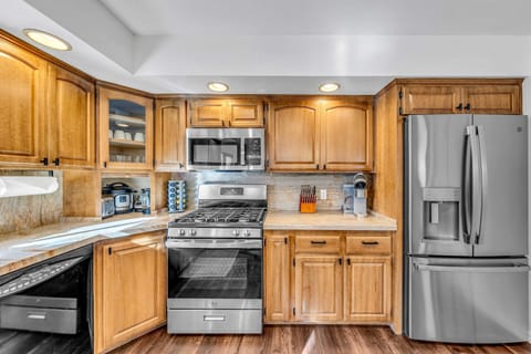 Kitchen: Keurig, Crockpot, blender, cooking utensils, tableware