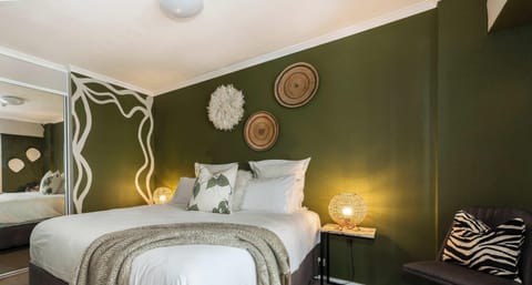 Large separate bedroom with plush king size bed