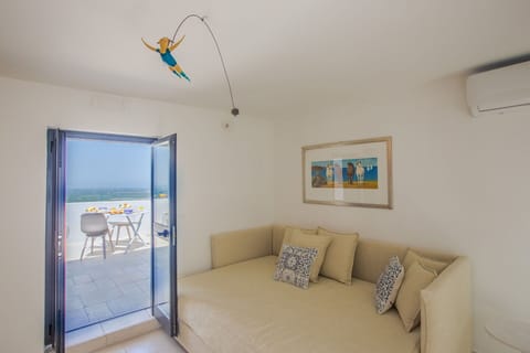 Furniture, Apartment, Floor, Shade, Hotel, Chair, Hardwood, Villa, Balcony, Pillow
