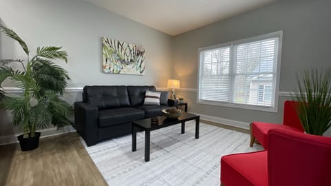 Unwind in our cozy living room, complete with a comfy couch and Smart TV for the perfect night in!