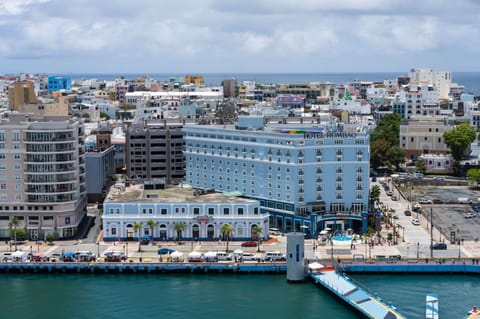 Aerial view of property near sea and city blocks