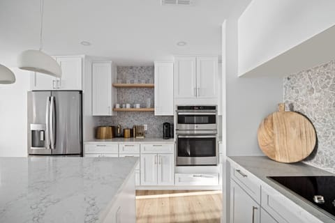 Modern kitchen details featuring built-in appliances and stylish finishes.