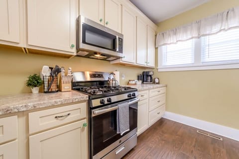 Fully stocked kitchen with gas stove.