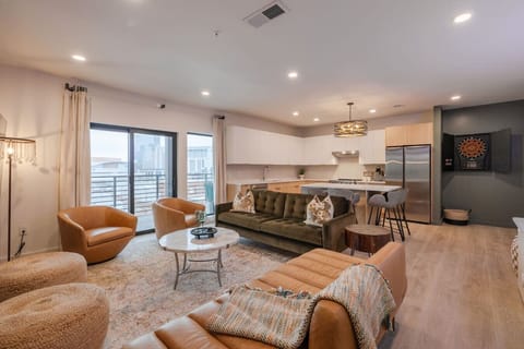 Living Room: features a cozy seating area with plush and earth-toned furniture.