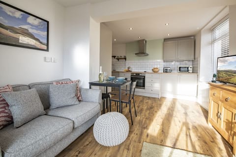 Ground floor: Sitting room leading to the well equipped kitchen