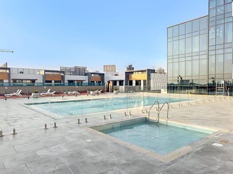 Poolside Oasis: Dive into relaxation at our stunning rooftop pool with breathtaking views!