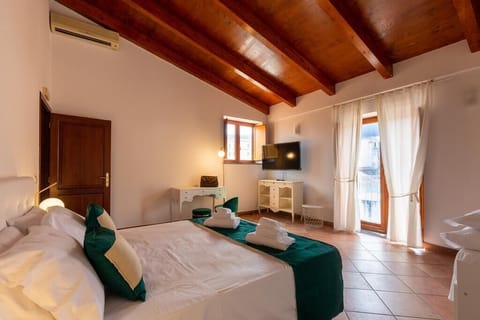 Family Apartment, Balcony, City View | 1 bedroom, desk, laptop workspace, blackout drapes