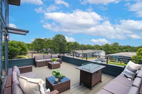 Spacious deck with outdoor seating and fire pit 