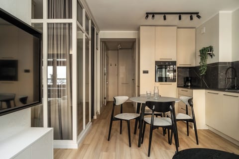 Apartment, Balcony, City View | Living area | Flat-screen TV