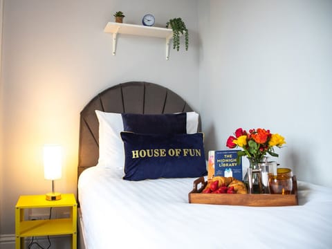 A comfortable double bed with fresh linens and towels ready for your arrival