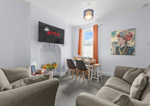 Relaxing in a cosy living space, enjoying a meal while your favourite shows play on the TV