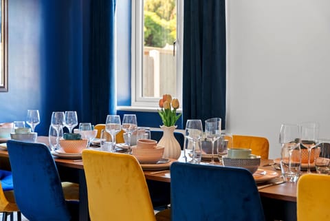 Spacious dining area with a large table seating up to 12—perfect for group meals.