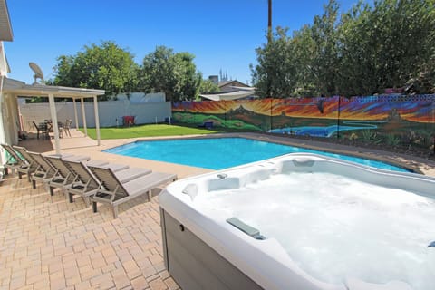 vibrant mural, private pool, 6 poolside loungers, and fun backyard games