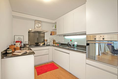 Family Apartment, Multiple Bedrooms, 2 Bathrooms (Ô Lac Ascona with Garden) | Private kitchen | Fridge, oven, stovetop, coffee/tea maker